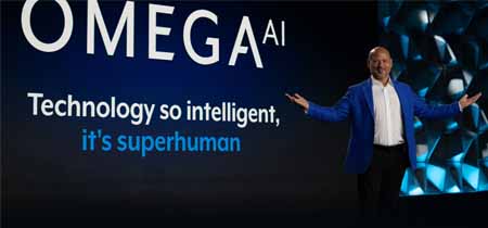 Brandon speaking on stage to a stadium of people.